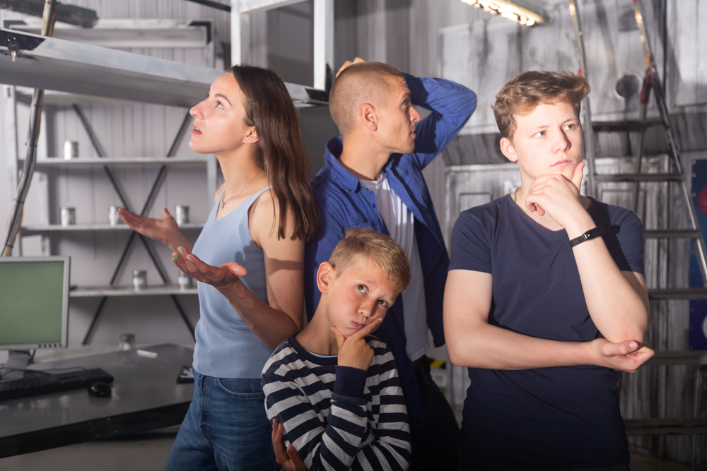 Two,Interested,Teen,Boys,With,Their,Parents,Trying,To,Get